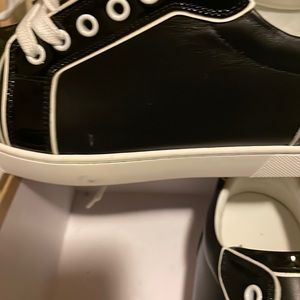 Brand  new Christian loubotin red bottom sneak shoe, size US 9, or size 40